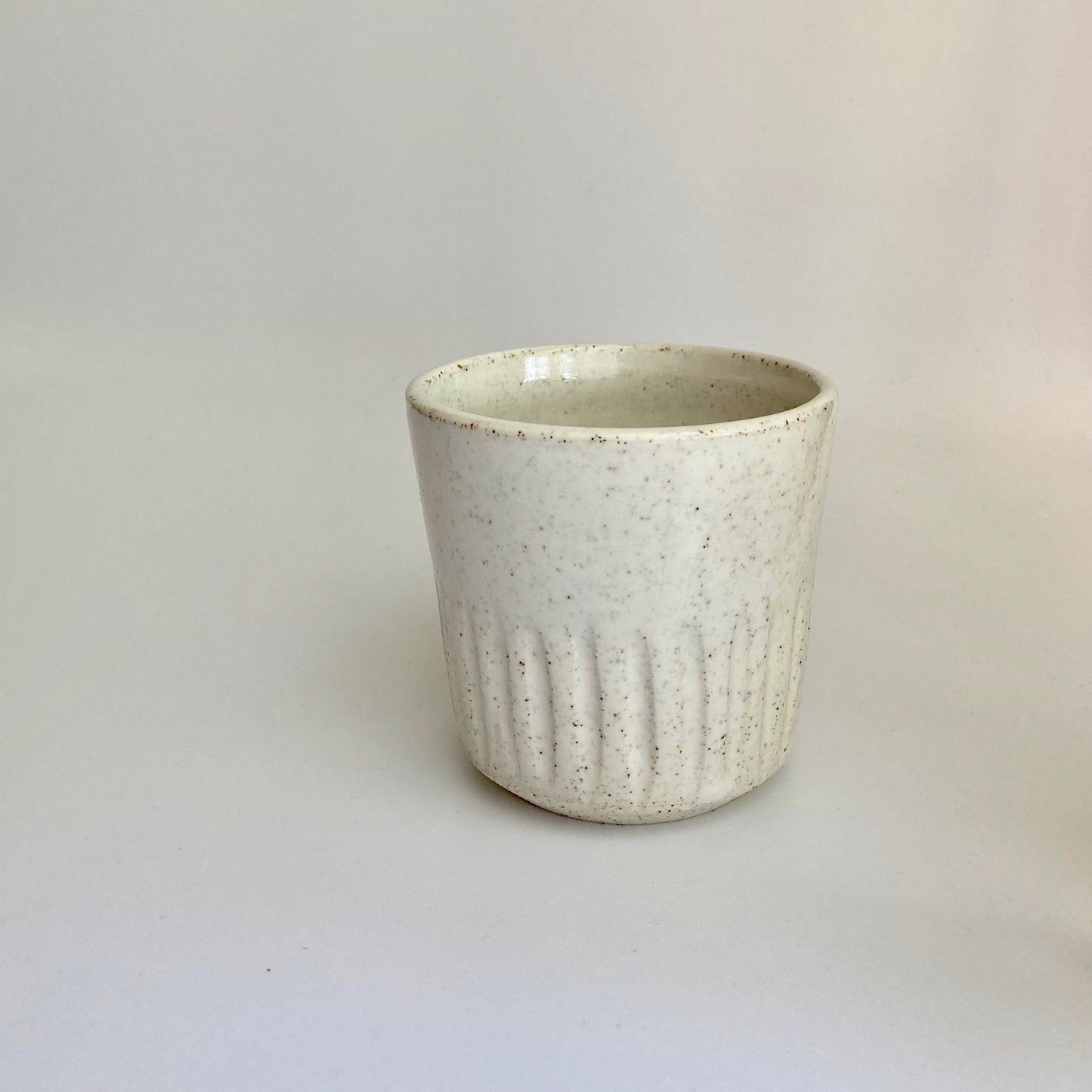 Tumbler ~ white speckle (bottom carved)